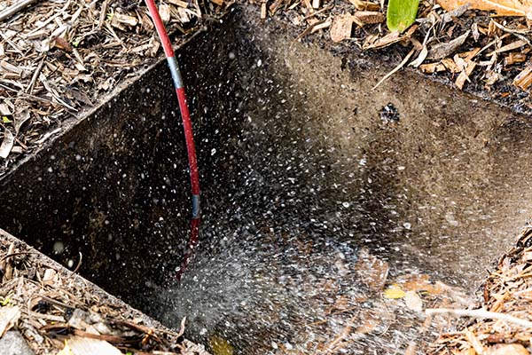 CCTV Camera Pipe Inspection in action with a pipe being put down a drain 